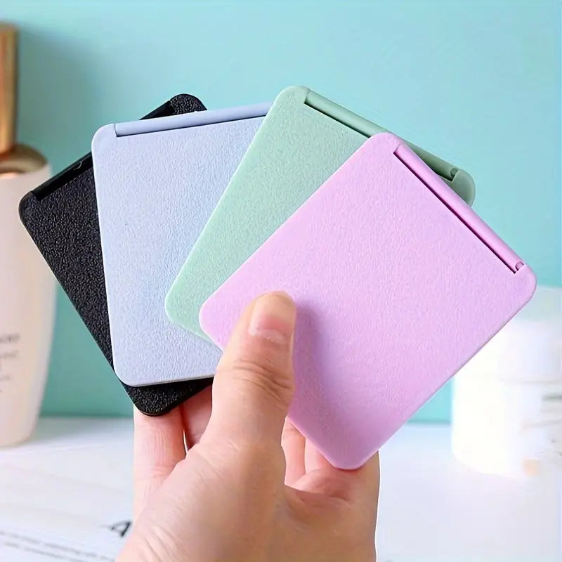 Double-Sided Foldable Cosmetic Mirror – Compact & Chic for On-the-Go Beauty