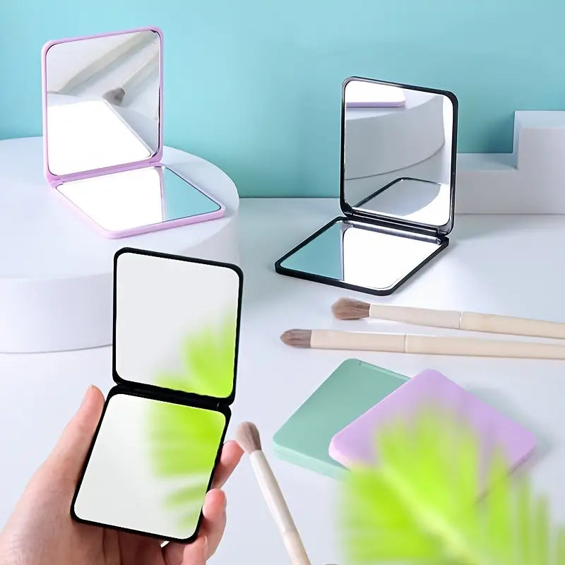 Double-Sided Foldable Cosmetic Mirror – Compact & Chic for On-the-Go Beauty