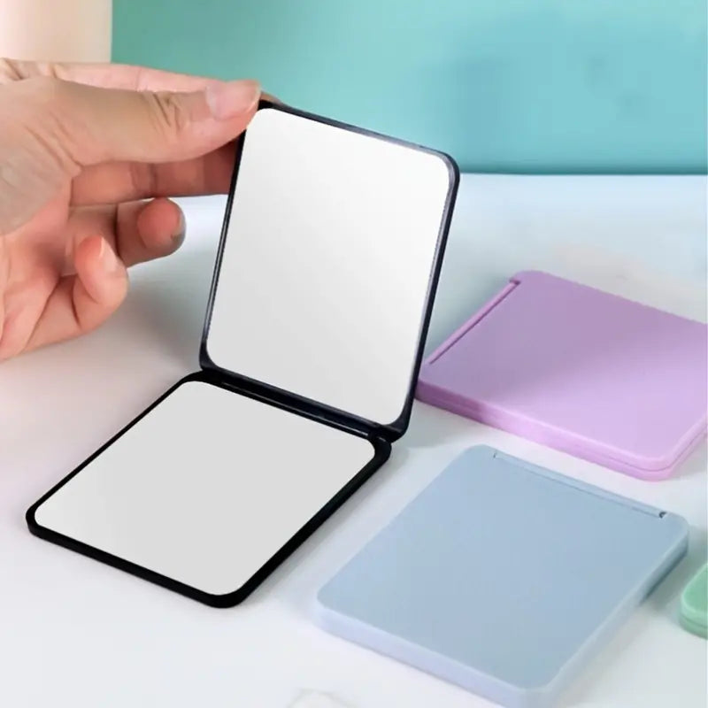 Double-Sided Foldable Cosmetic Mirror – Compact & Chic for On-the-Go Beauty